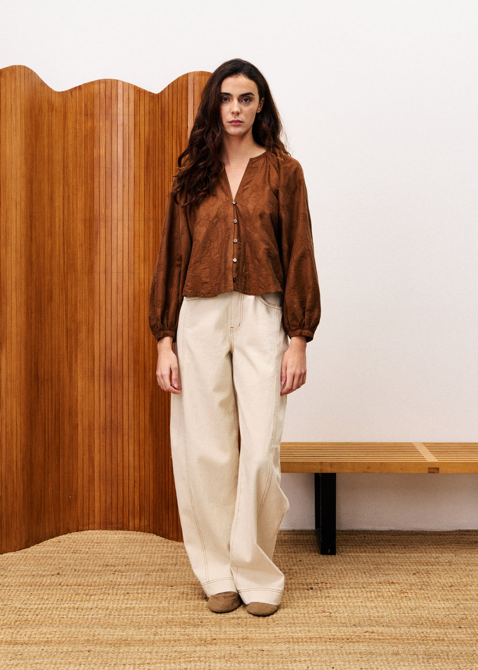 Pensee blouse in textured fabric with long puff sleeves, V-neckline, and loose flowing fit.