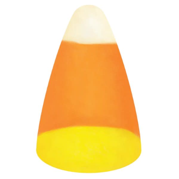 Candy corn table accent featuring a three-dimensional stacked pumpkin shape with orange, yellow, and white striped pattern.