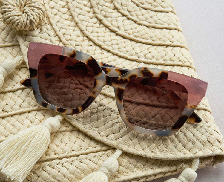 Nell reading sunglasses with recycled polycarbonate frames in black featuring polarized lenses and spring hinges.
