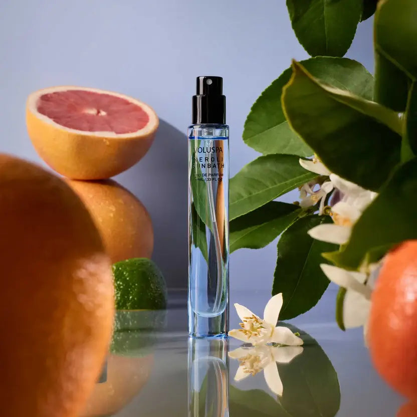 Neroli Sunbath Eau De Parfum bottle with a clear glass body, gold cap, and minimalist label design.