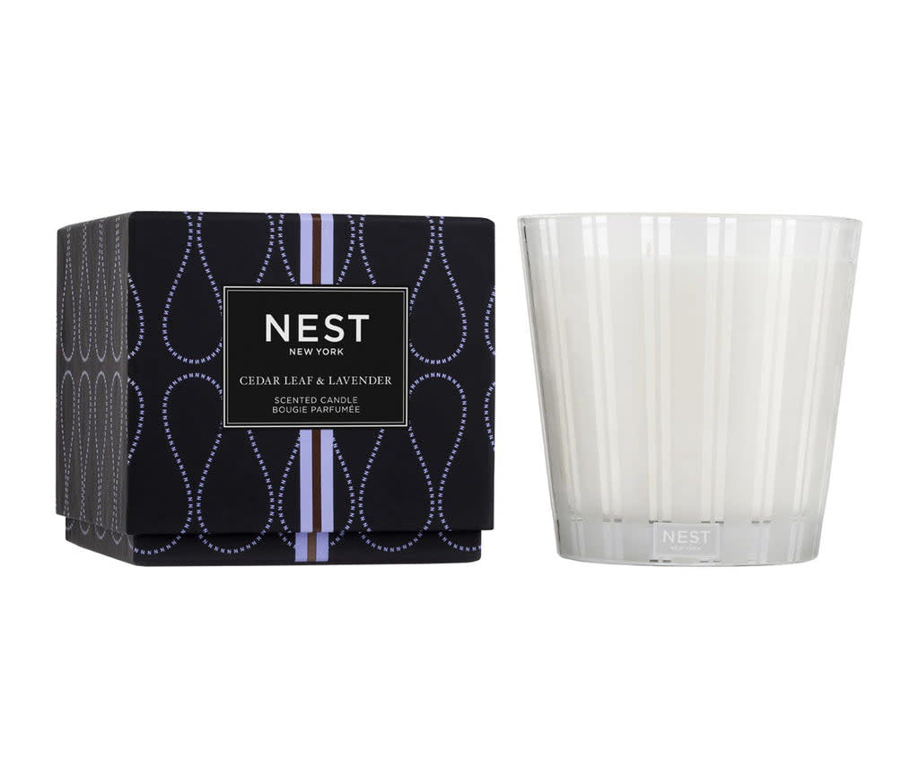 Nest three-wick candle in Cedar Leaf Lavender scent with a cylindrical glass jar and neutral wax.
