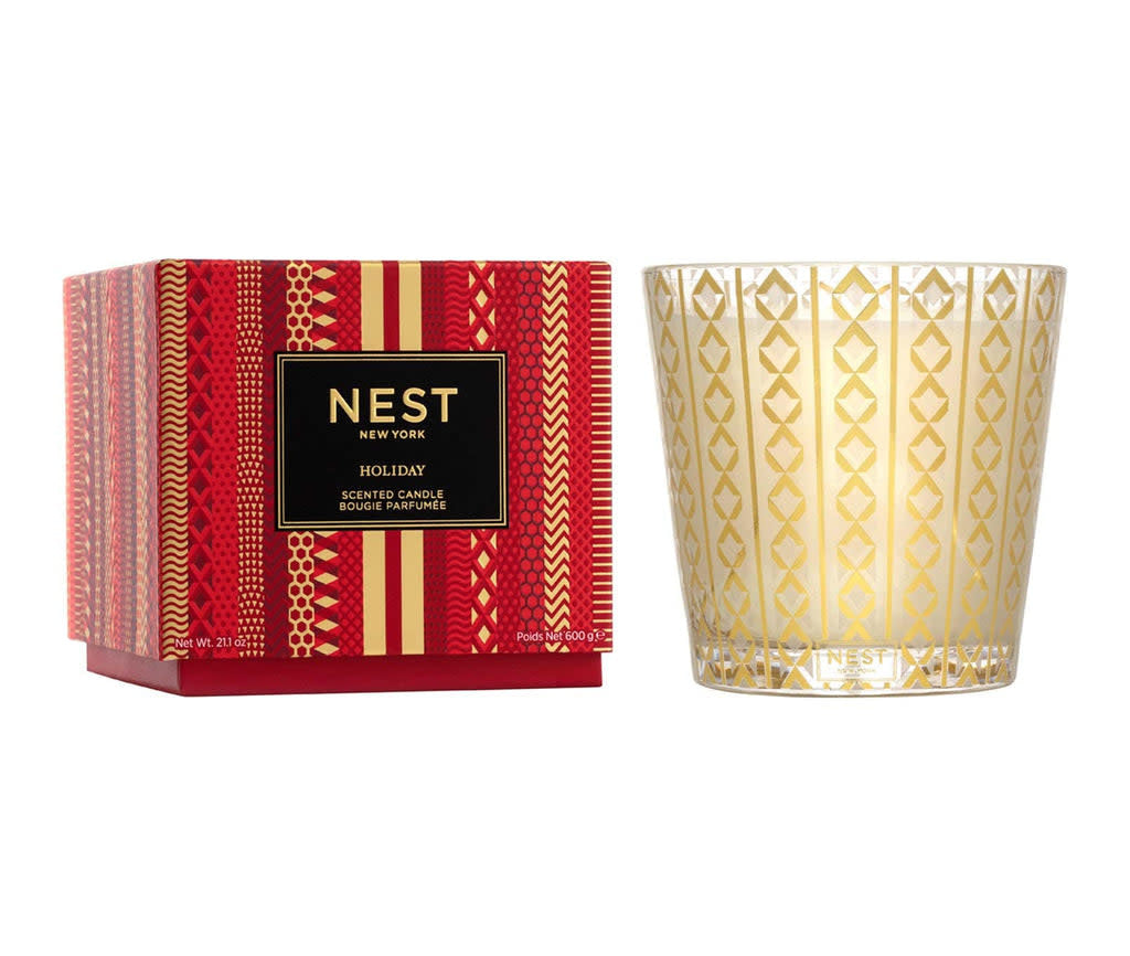 Nest three-wick candle in a clear glass jar with white wax.