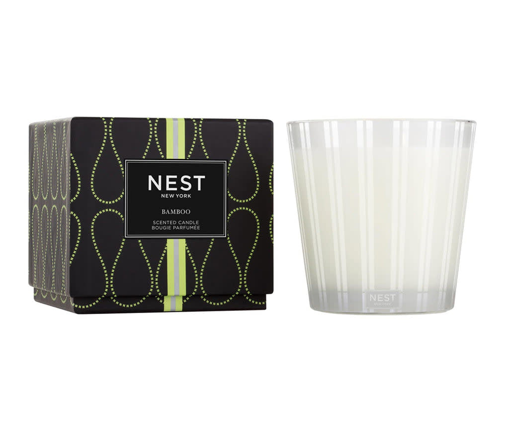 Nest three-wick candle in a cylindrical glass jar with white wax.