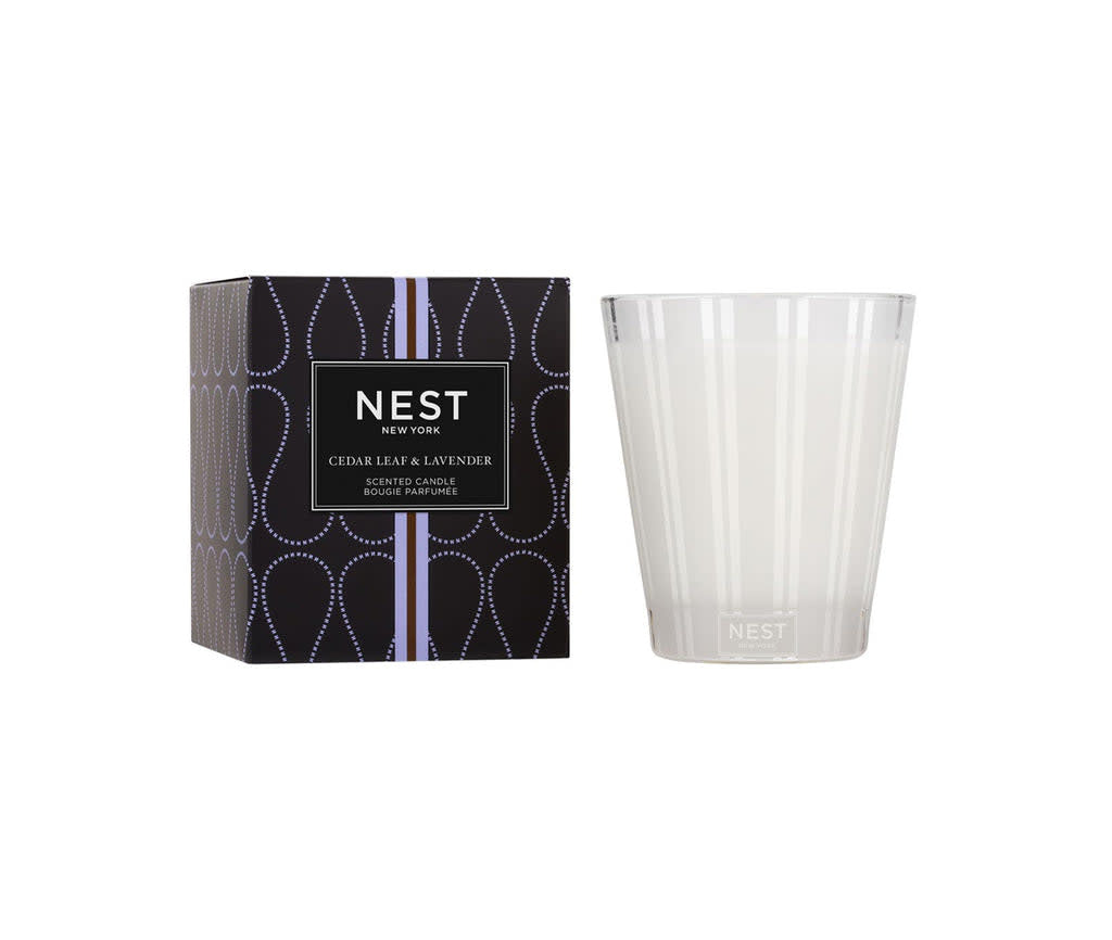 Nest Classic Candle in Cedar Leaf Lavender scent housed in a simple glass jar with white wax.