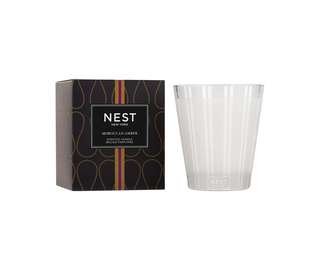 Nest Classic Candle in Moroccan Amber with a smooth beige wax surface inside a clear glass jar.