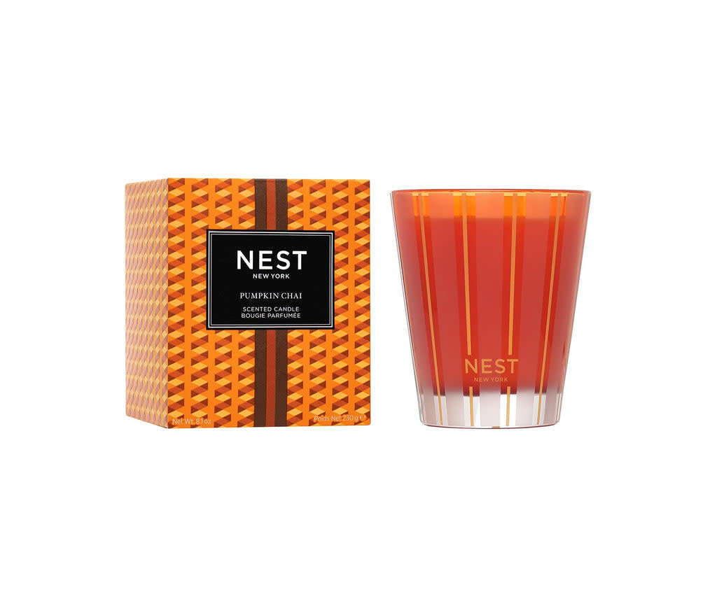 Nest Classic Candle in Pumpkin Chai scent housed in a simple glass jar with a black wick.