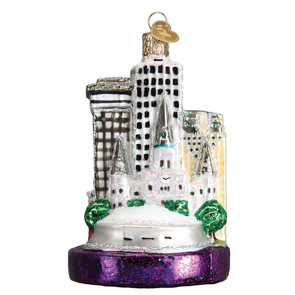 Hand-painted glass New Orleans ornament with silver accents in a festive shape.