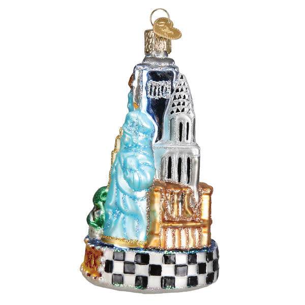 Glass New York City ornament with silver accents depicting the Statue of Liberty in blue against a white background.