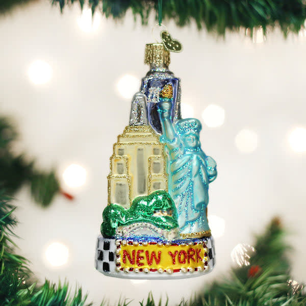 Glass New York City ornament with silver finish featuring Statue of Liberty and Empire State Building silhouette.