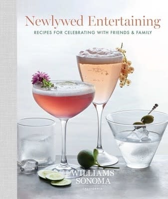 Newlywed Entertaining cookbook featuring a photograph of three cocktail glasses on a table.