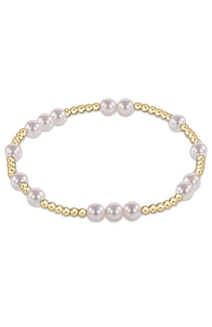 Extends Hope Unwritten bracelet featuring gold-filled beads and crystal pearls on elastic cord.