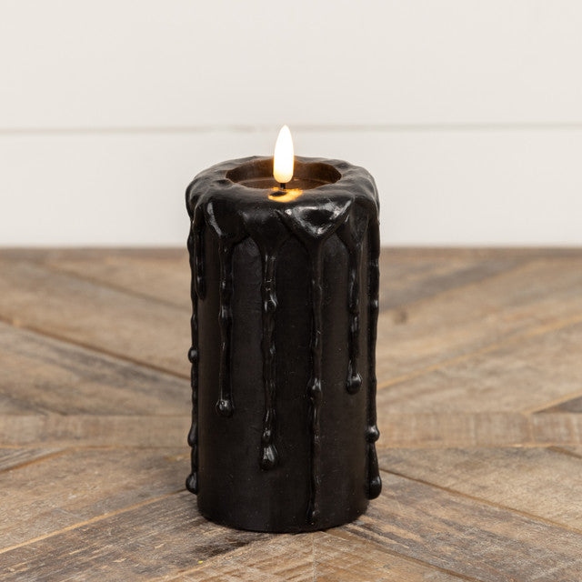 Black plastic pillar candle with realistic flickering flame effect on top.