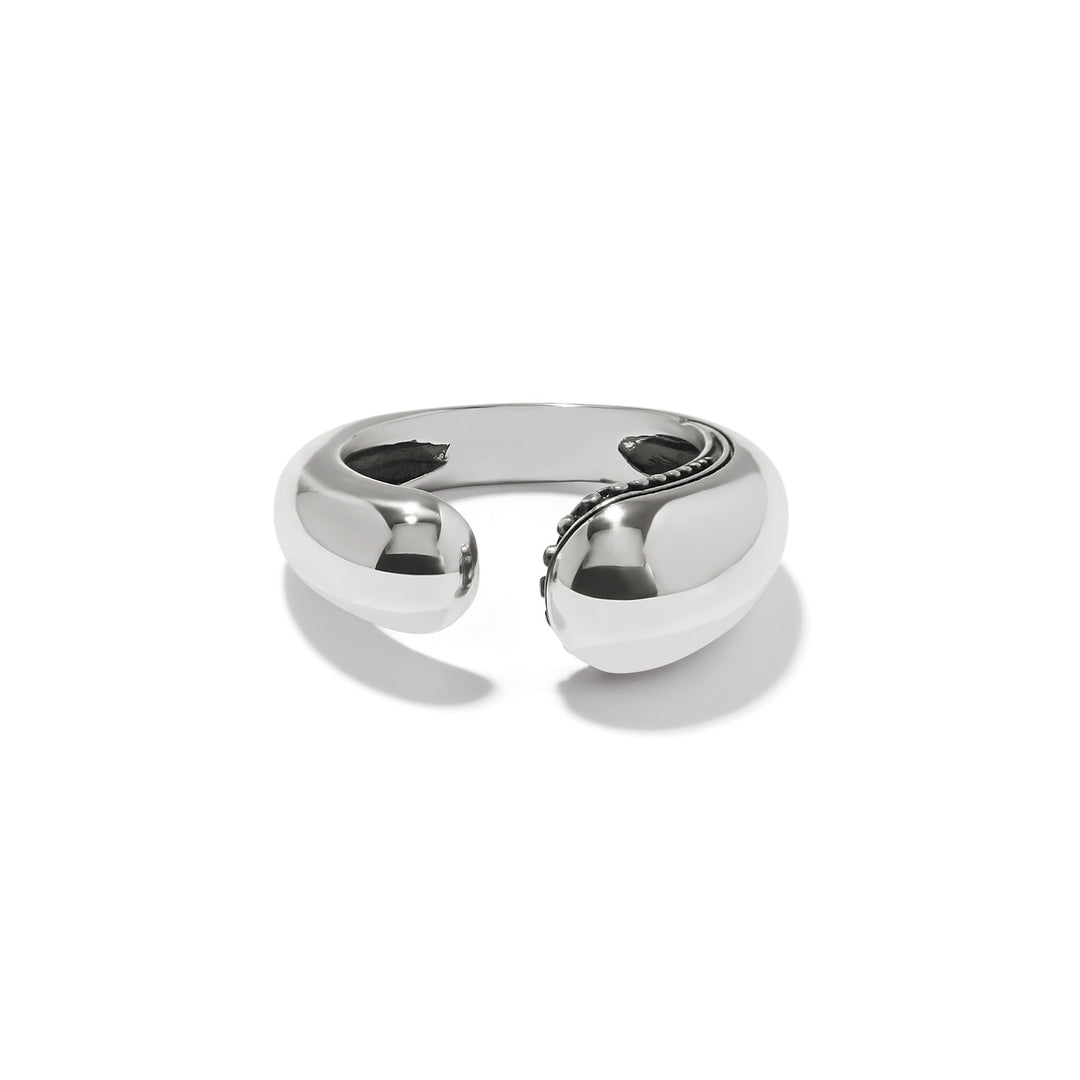 Silver plated droplet ring with organic curved silhouette featuring tiny beading on one side and smooth finish.
