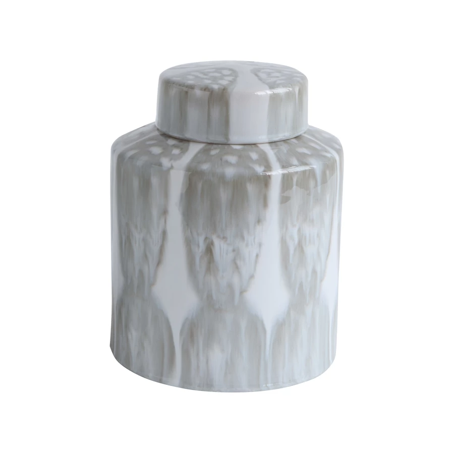 Round stoneware ginger jar with a decorative handle and textured surface.
