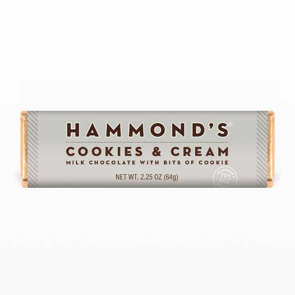 Cookies and Creme milk chocolate bar with visible cookie pieces in a creamy white coating.