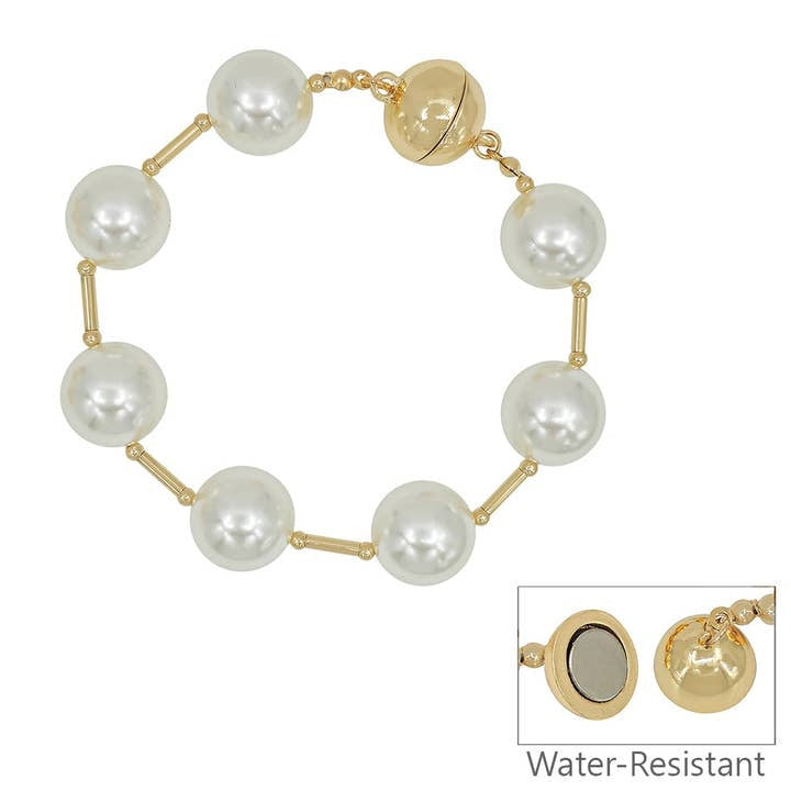 7.5-inch gold magnetic bracelet featuring a string of white pearls with a matching clasp.