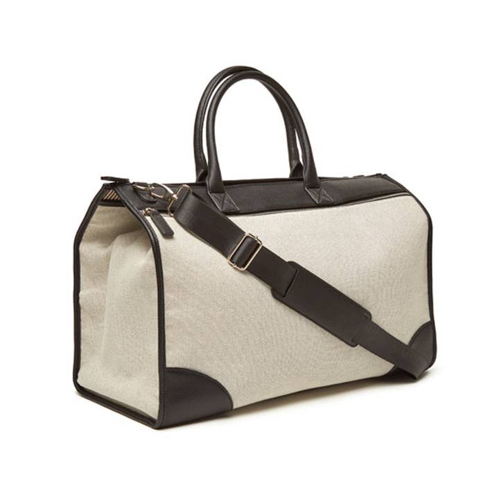 Black Capri boarding bag with structured rectangular shape.
