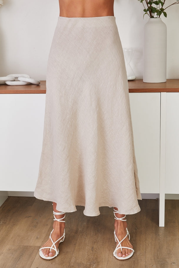 Eleanor crinkle linen midi skirt in natural tone with relaxed A-line silhouette.