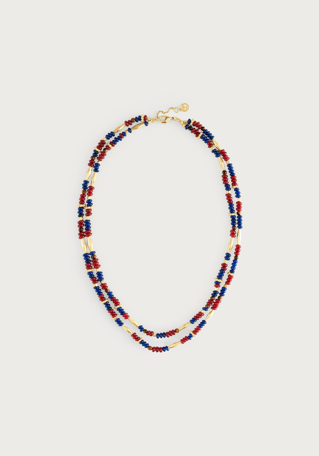 Double-strand Milos necklace with garnet, navy, and brown beads and 18K gold-plated brass accents.