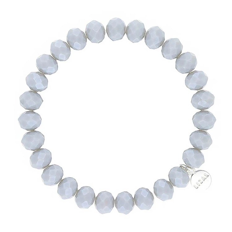 Lizas Quadro Big crystal stretch bracelet with faceted light grey beads and a silver logo charm.