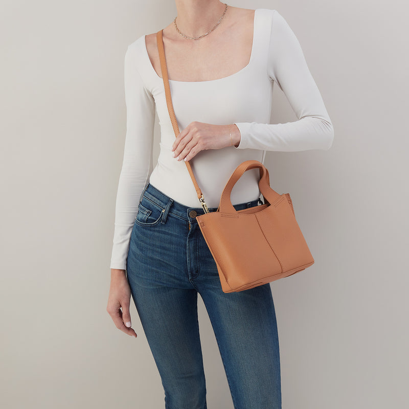 Vida small tote in biscuit leather with brushed antique brass hardware.