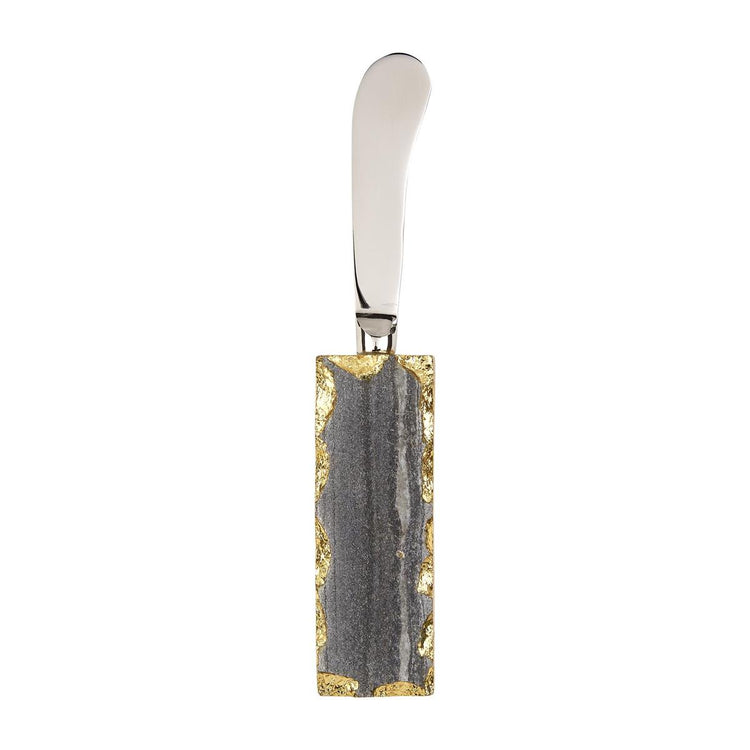 Stainless steel spreader with a rectangular grey marble handle featuring gold foiled raw edges.