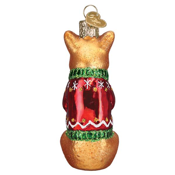 Christmas Corgi ornament featuring a red dog figurine with white accents on a gold stand.