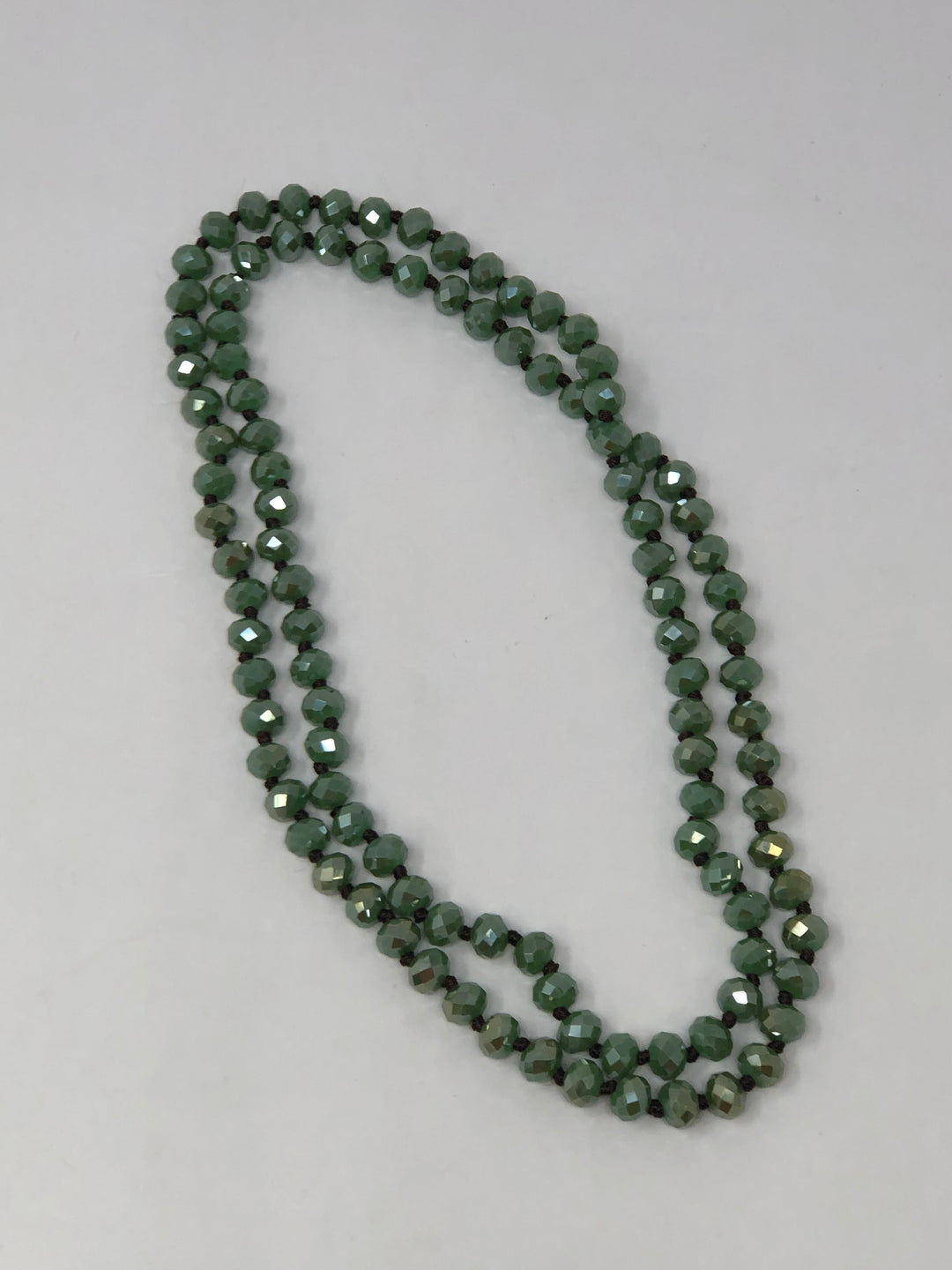 36-inch dark brown crystal beaded necklace with knotting between each bead