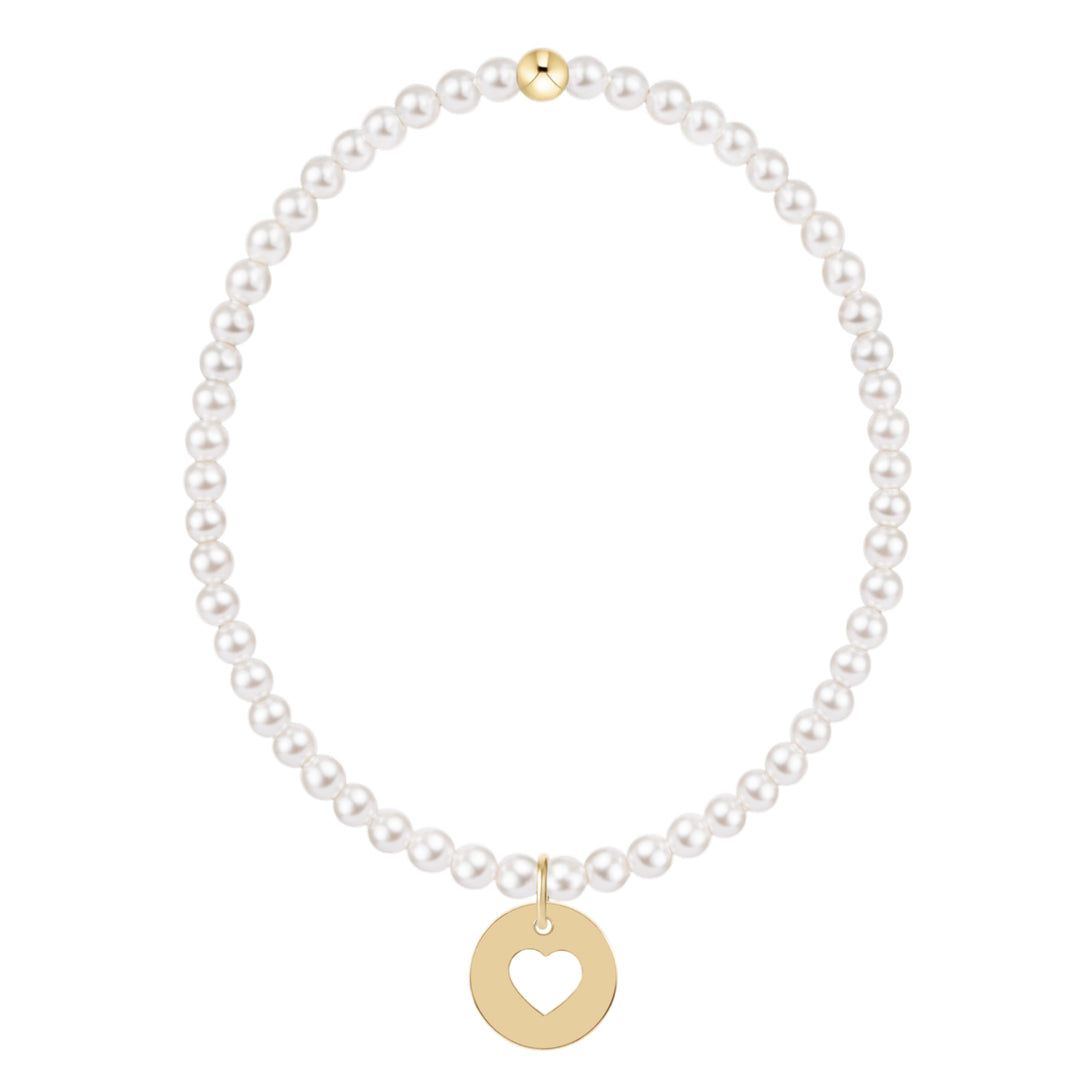 Classic 3mm white pearl stretch bracelet with a 14kt gold-filled heart cutout disc charm.