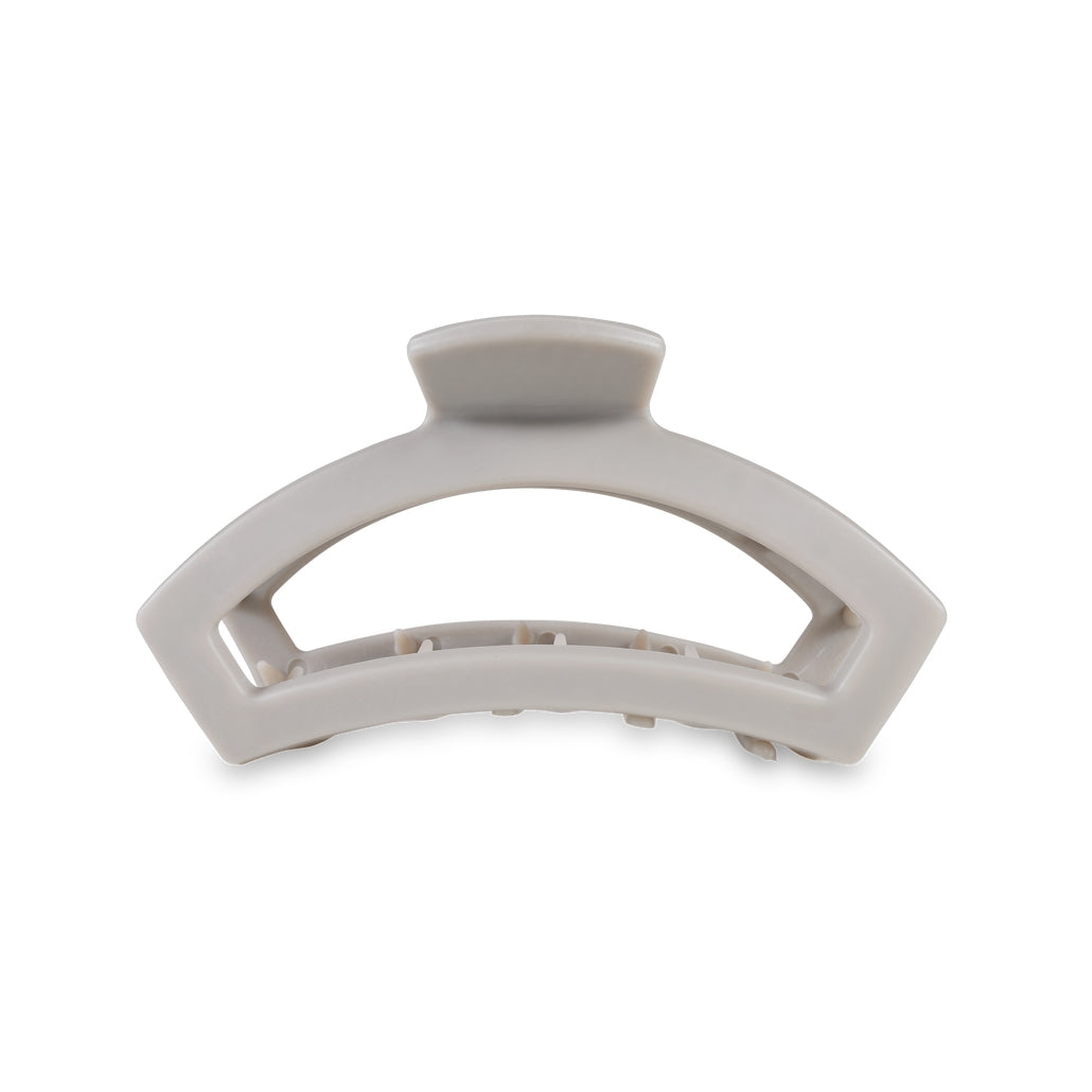 Medium open-style hair clip with bendable teeth in a neutral tone.