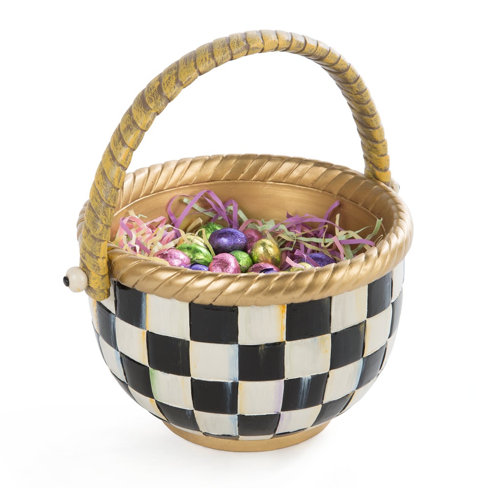 Hand-painted black and white checkered resin basket with a gold handle and rim, filled with eggs.