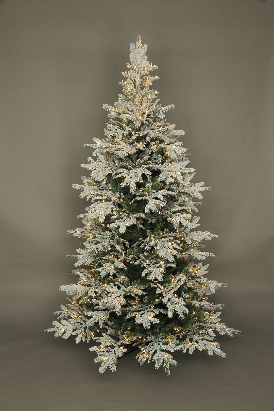 7.5' Rebecca Flocked Noble Fir Tree with 550 warm white LED lights and snowy white branches.