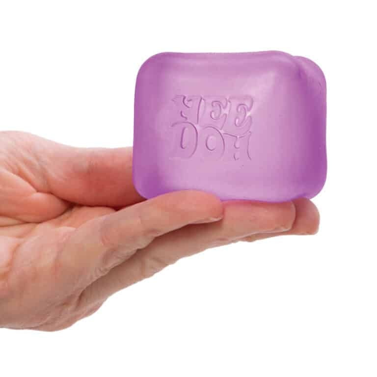 Purple semi-transparent square NeeDoh Nice Cube stress reliever with goo filling