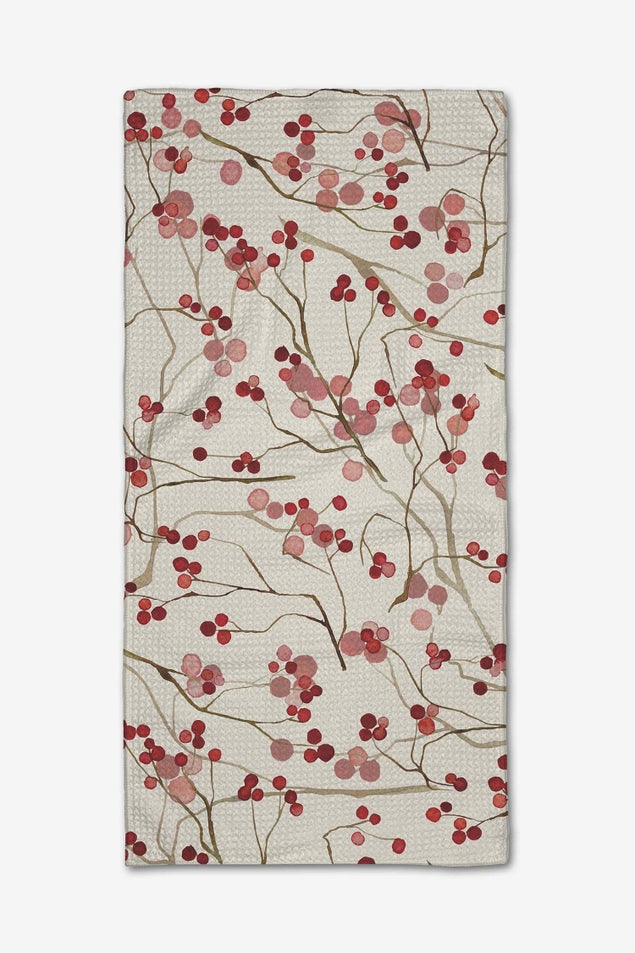 Mini towel featuring a watercolor pattern of red and pink berries on thin brown branches.