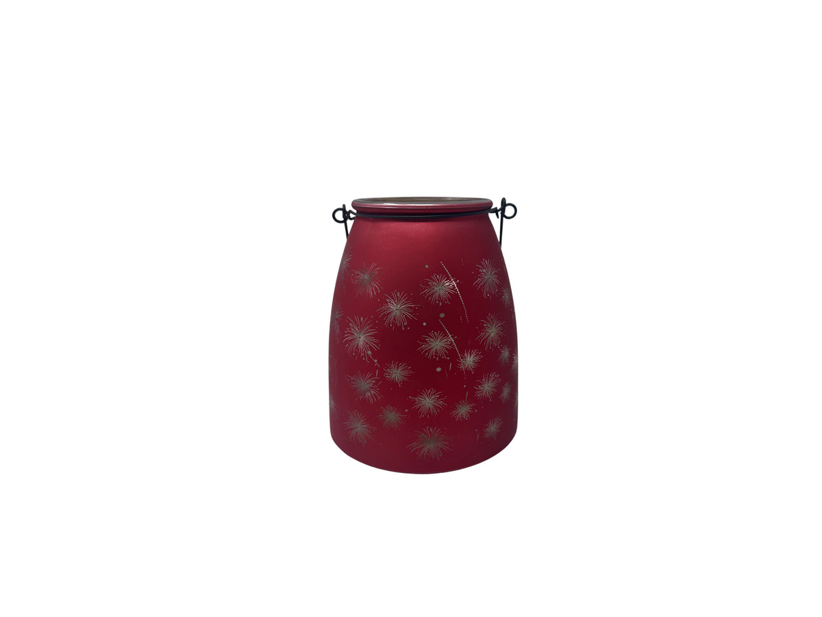 Red glass LED jar with silver firework patterns and a black wire handle.