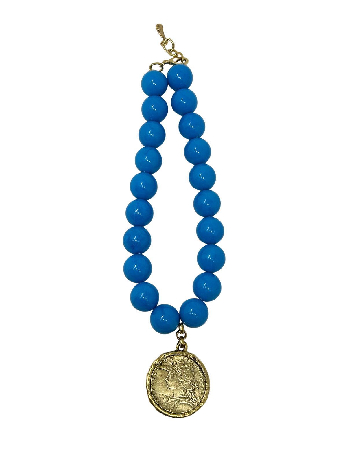 Vintage 18-inch necklace featuring large bright blue beads and a gold-tone coin medallion pendant.