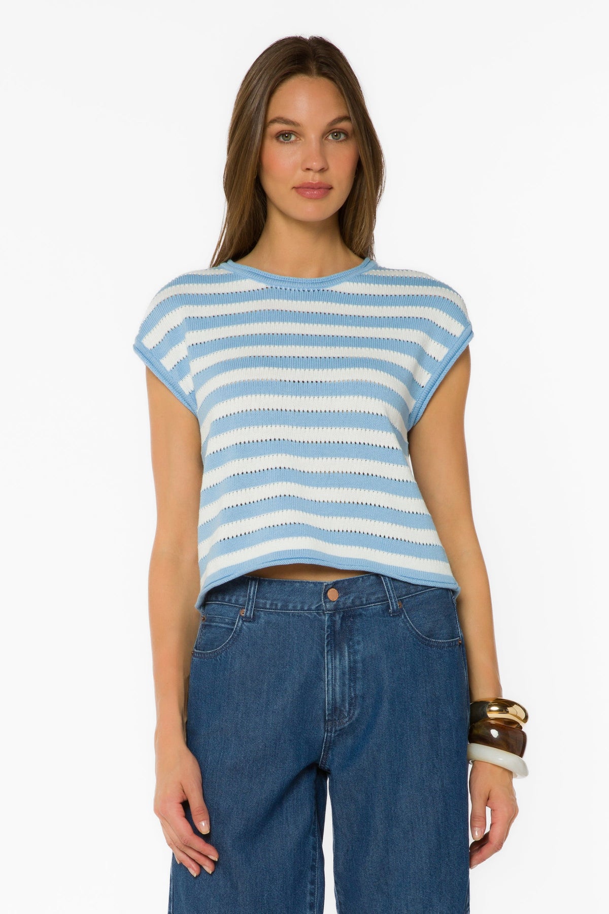 Woman wearing the Abree Optic White and Cool Blue striped short sleeve crewneck sweater.