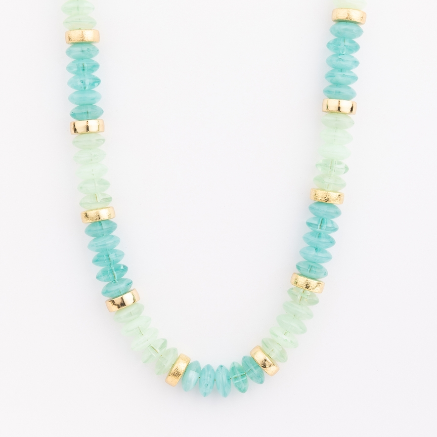 Jules Necklace featuring alternating light green and teal glass beads with gold-toned spacers.