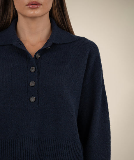 Relaxed fit long sleeve button front sweater in soft knit fabric with ribbed cuffs and hem.