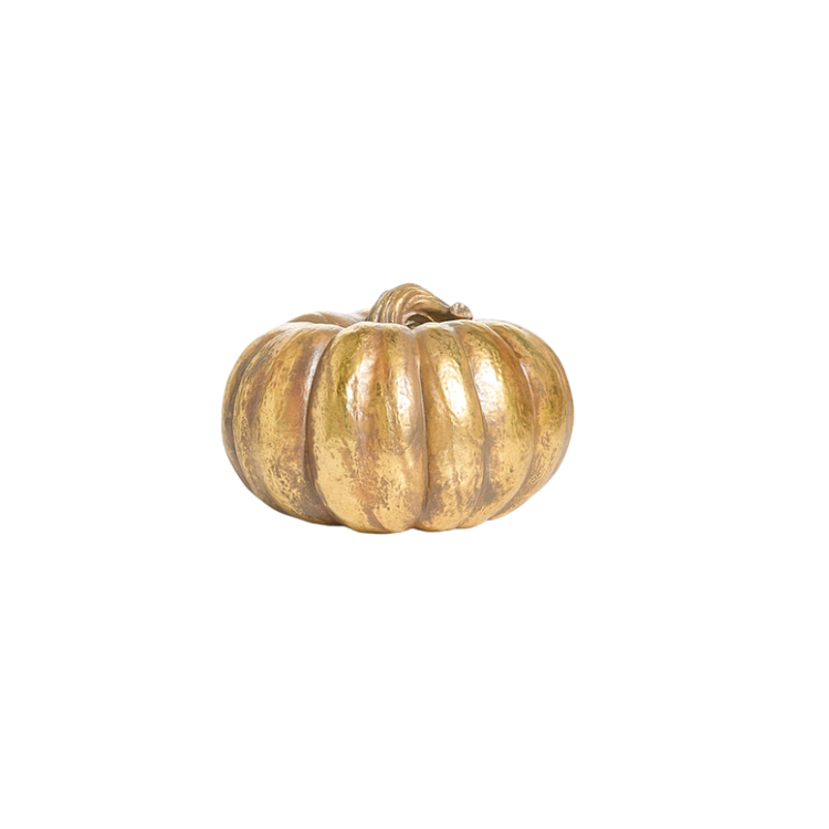 A decorative gold resin pumpkin with a textured metallic finish and a curved stem.