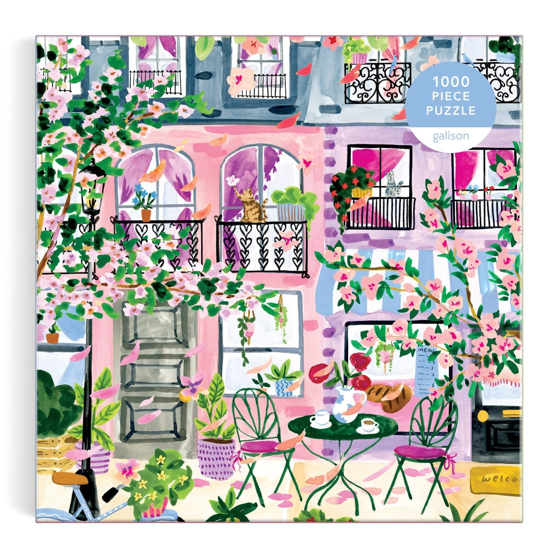 Cherry Lane Blossoms puzzle box showing colorful houses beneath a canopy of pink cherry blossoms.