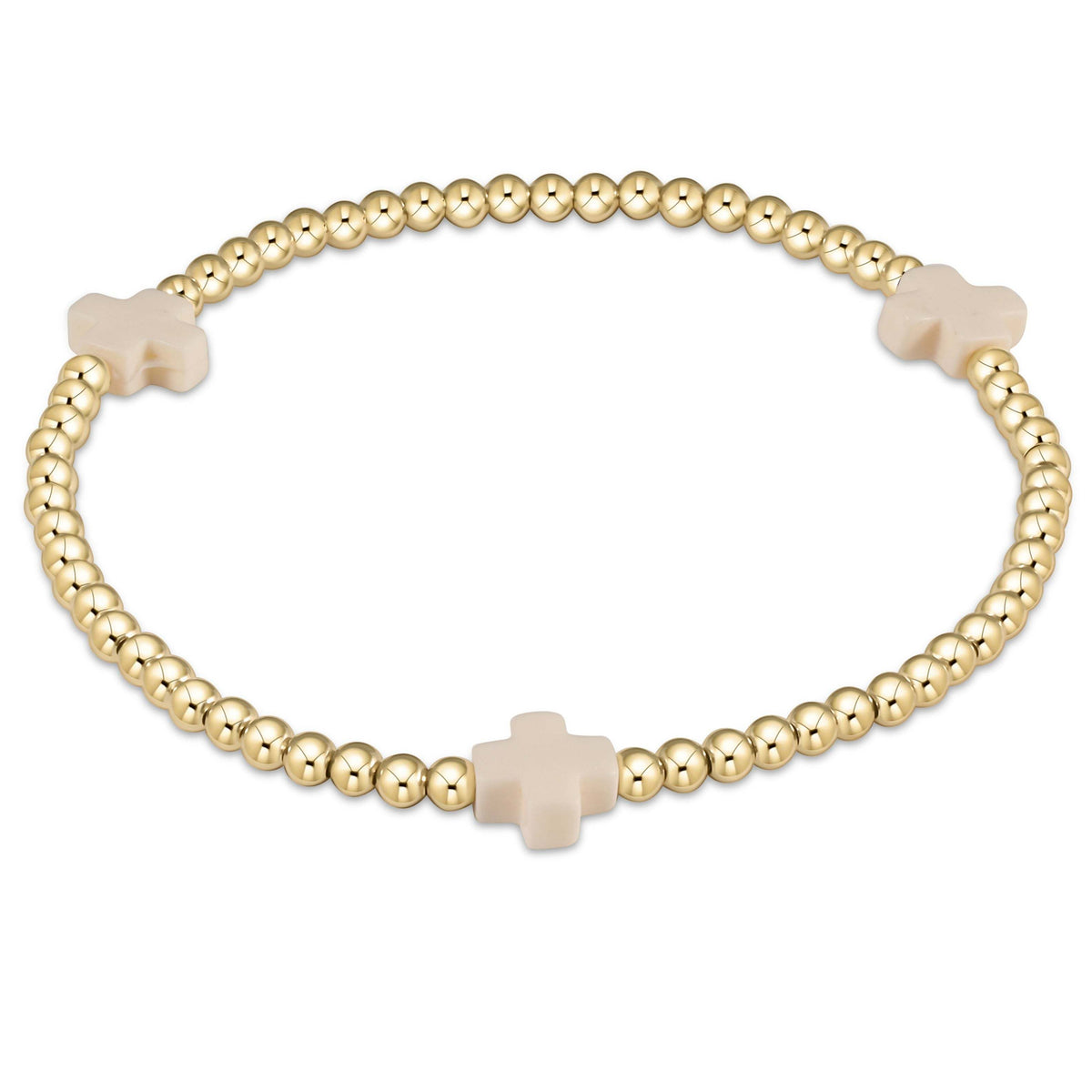Hand-beaded bracelet with a signature gold cross pendant on elastic cord.