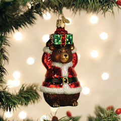 Christmas Bear ornament in red with white accents depicting a bear wearing Santa's jacket.