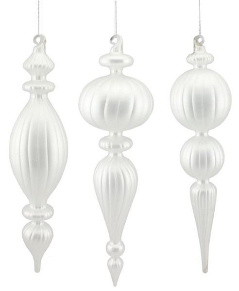 Set of three white frosted glass finial Christmas ornaments with ribbed textures and varied shapes.
