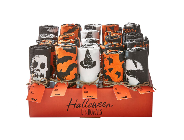 Assorted Halloween dishtowels with skull, bat, witch hat, and pumpkin designs in a display box.