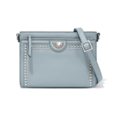 Light blue leather Jordyn Cross Body Organizer with silver stud detailing and adjustable strap.