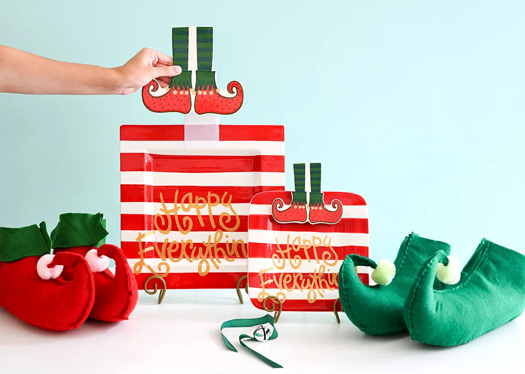Red and green elf boots attachment on a striped Happy Everything platter with matching accessories.