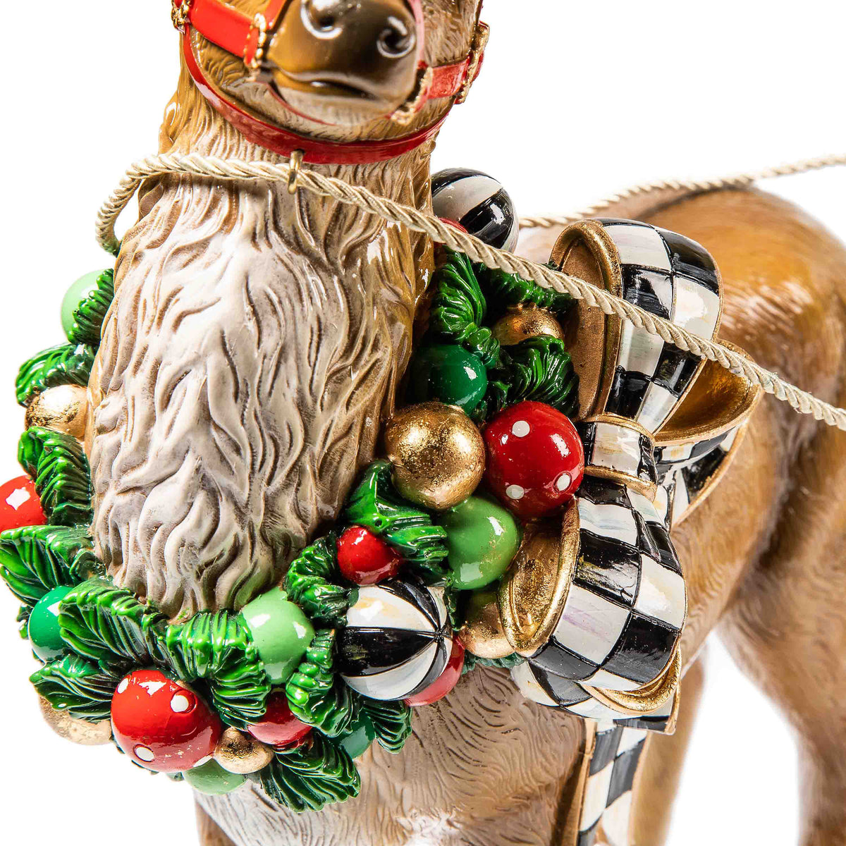 Resin night light shaped as a sleigh with Santa Claus figure in red suit and green reindeer.