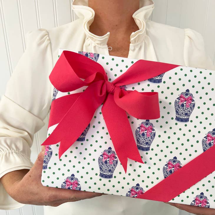 Ginger jar wrapped in pink bow gift wrap sheets with vibrant opaque paper.