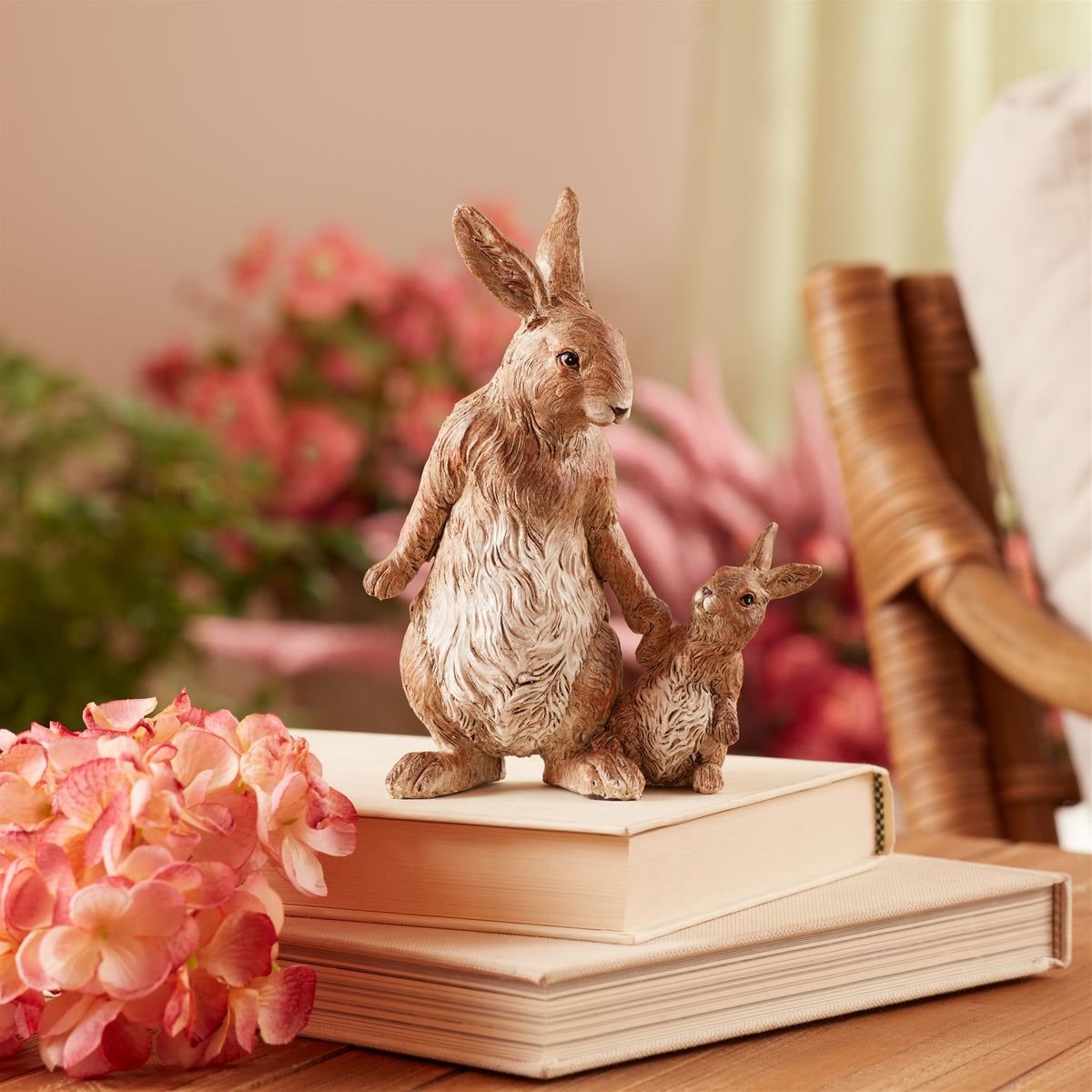 Resin figurine of a white rabbit with bunny ears standing upright.